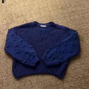 blue crocheted sweater